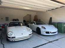 With her much younger sibling, my 991.1S daily. 
 Excuse my dirty garage.