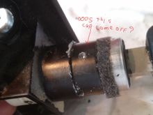 That black ring/cap does it come off ? Do I need to drill further in to release the cylinder ?