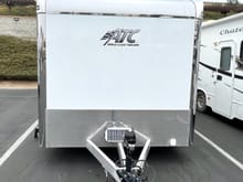 Front view with the mini solar panel see above the 4' trailer tongue. The electric tongue raising device can be seen as well