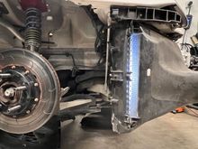 i put a light in the duct to see how big of a gap the air would have without the AC condensers in front of the side rads... it's a lot.