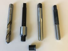 From left and in order of use: Drill to enlarge the existing bolt hole for the new insert; Counterbore tool so that the hole accepts the flange of the insert; Tap for the insert; and driver tool to permanently install the insert by expanding the last few threads on the insert itself.