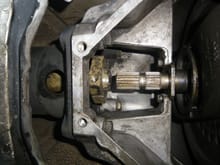Push the torque tube coupler back as far as possible - approximately flush with the bellhousing.  This photos is from the removal but coupler is gold part to left side of intermediate shaft