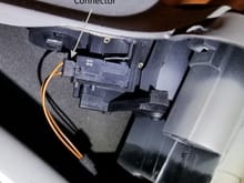 Small 2-wire connector attached to microswitch.