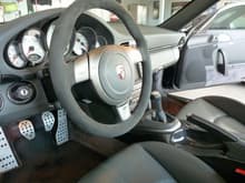 GT3 Alcantara steering wheel with carbon fiber trim and AWE pedals