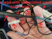 This is the small wire that is wrapped together with the antenna lead -- it was connected to the "auto-antenna" lead on the prior Clarion stereo head.
