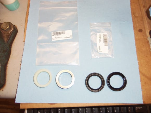 New nylon bushing and new seal on the left, old steel bushing and old seal on the right.