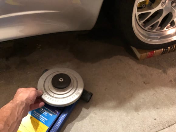 If your RS height leave the book so you can slide the jack stand top out. Then jack the left rear wheel up a few inches to remove the book and you’re done! 