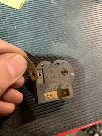Electrical tab snapped off due to rivet head failure. 