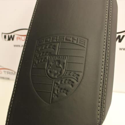 He does custom leather work. This armrest has custom embossing that he can do.