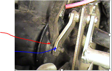 How do i separate the arm from the motor screw (see Red arrow). 
The blue arrow arm simply pulled away once the circlips were removed