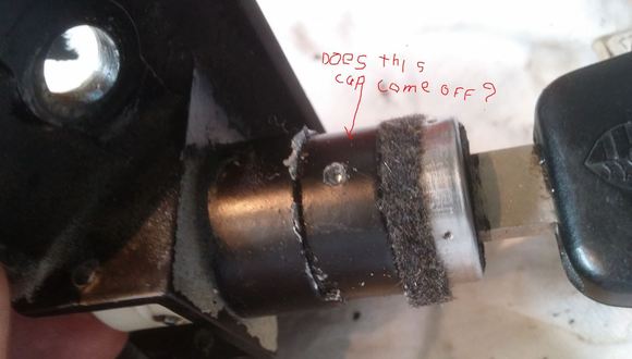 That black ring/cap does it come off ? Do I need to drill further in to release the cylinder ?