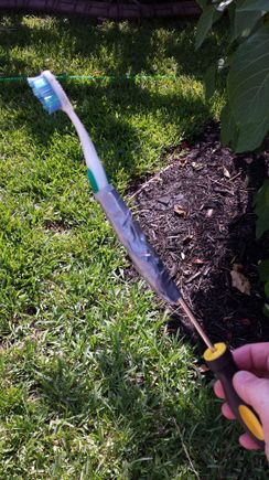 Very inexpensive cleaning tool for the hard to reach areas.  Started with just the toothbrush and then 'extended' it to get farther back.