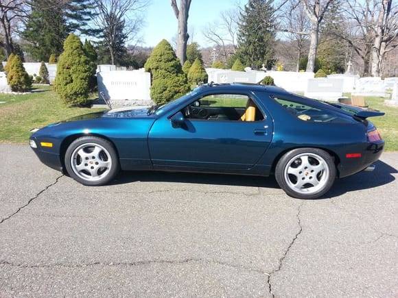 My 93 928GTS 5 speed. The backdrop is Mark Donahue's grave my in-laws are a row or two back. Old photo but great shot. 