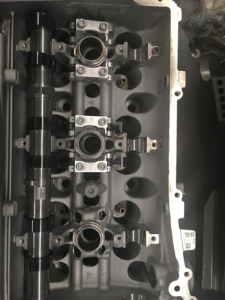 Here is a shot of the new pats installed in one of our test heads. The rear cylinder shows the support rigs in place, the center cylinder shows the fingers in place and the front cylinder shows the machineing required to the existing head. 