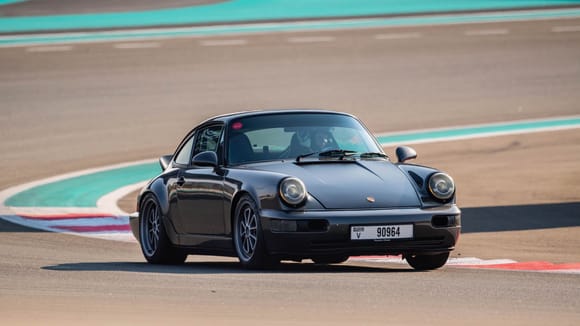 Porsche 964 on track at Yas Marina Circuit 2023