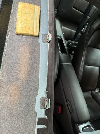 Clips on headliner that press fit up into sunroof surround