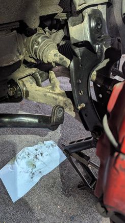 Removal of stock links... brake duct cover rusted broken bolt = fun!