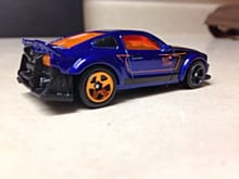 I got this SEMA Mustang today. It may be odd. But, Hotwheels has added some nice casting features like the adjustable front chin spoiler so it can run on the loops and still look cool and normal without a funky looking swept up angle and the fact that the car has headlights and taillights cast in from the window piece.