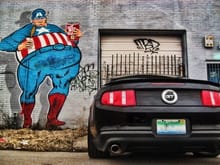 2011 Mustang GT in front of graffiti on Grand Blvd in Detroit.
