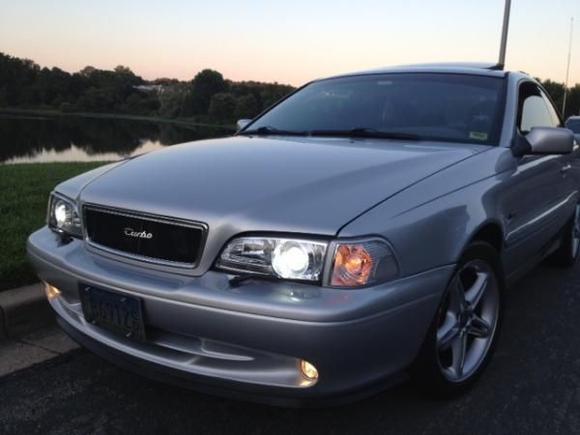 Repainted front bumper, added projector headlights, aftermarket grille and front bumper lip