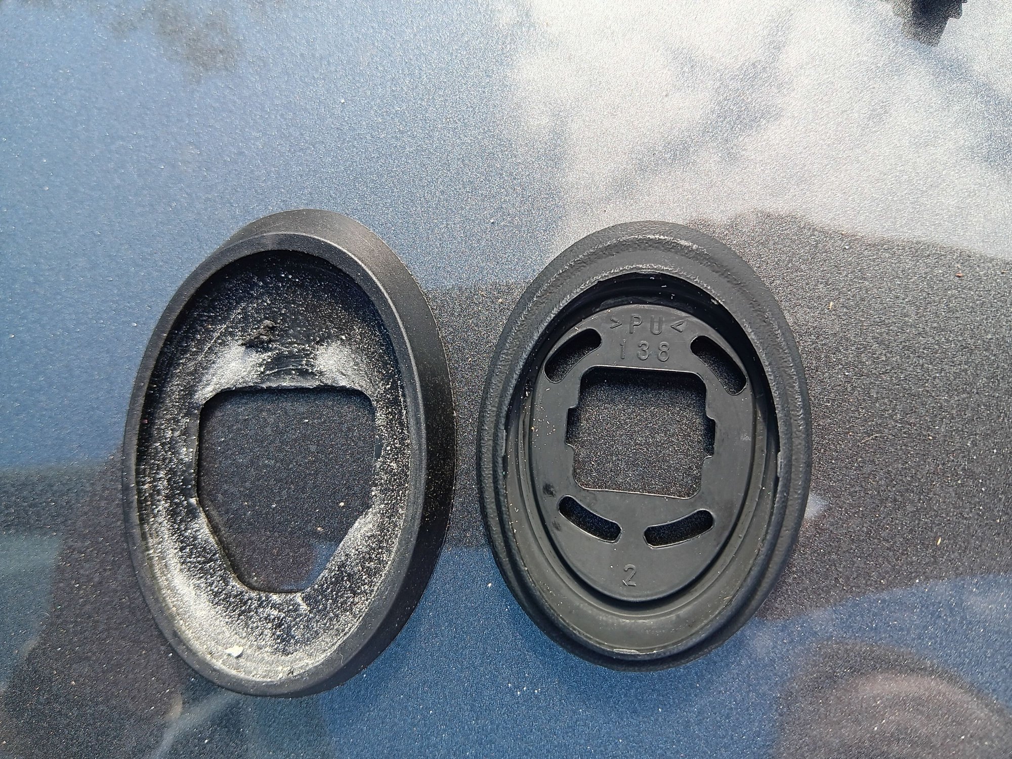 Amazon to the left, OEM to the right. The powder is corrosion from the antenna base after I removed it to replace the new OEM gasket and base. 