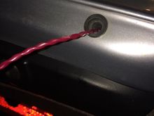 Two exits , one each side under the boot / trunk lid edge .
Water should run out and flow over the bumper .