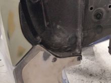 Driver's side rear where rocker panel meets fender flare