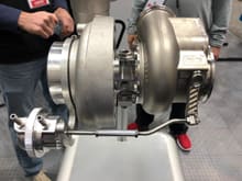 Xona Turbo from the PRI show in December showing off the prototype dual port wastegate actuator. This didn't really make the "news", but is a big deal for internally gated setups. Also note the 3D printed wastegate actuator arm (right), we upgraded my turbos with the longer arm for more leverage on the wastegate as well.