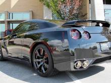 2010 Nissan GTR - Debadged , door handles painted black, all metal side vents and other aluminum painted in candy apple black to give a cleaner black out look