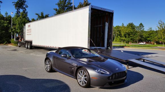 The AM parked next to the delivery trailer