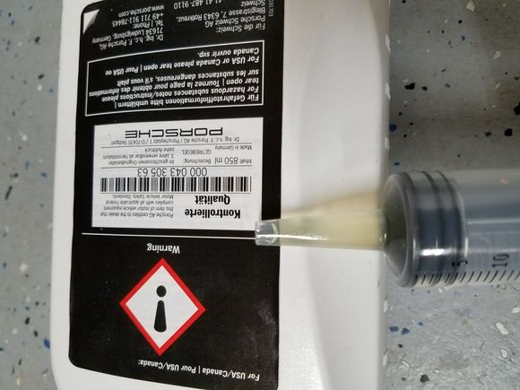 New Porsche fluid. 
Could get the pump to drain the bottle so I used a syringe to get the rest of the fluid in.