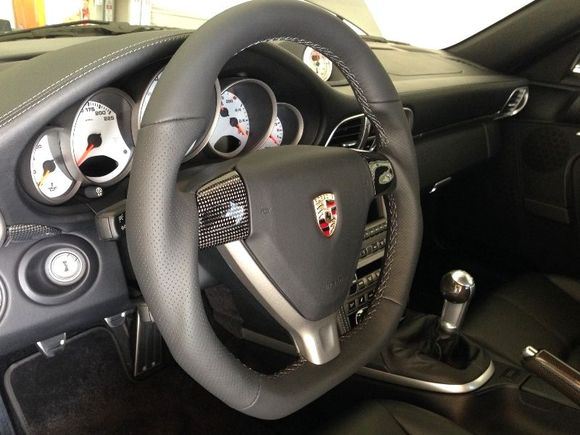 Porsche 997 Turbo with DCTMS sportive flat bottom steering wheel installed; the carbon tabs matched the rest carbon pieces came with the car