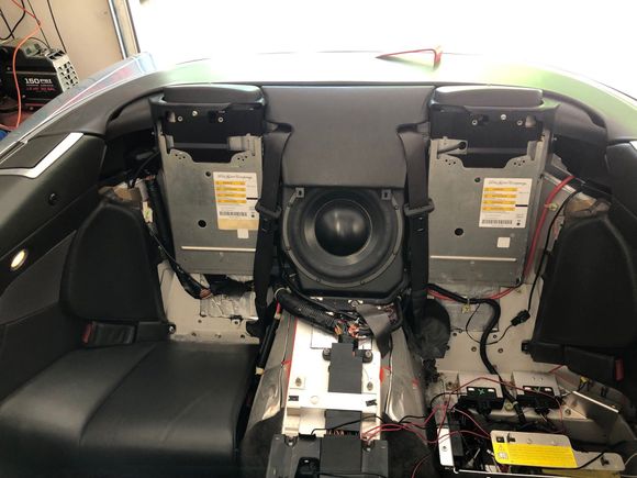 '06 DB9 Volante with lots of stuff removed in the back. You don't need to remove the right side (left in picture) seatback like I did. See the big red cable at far right.