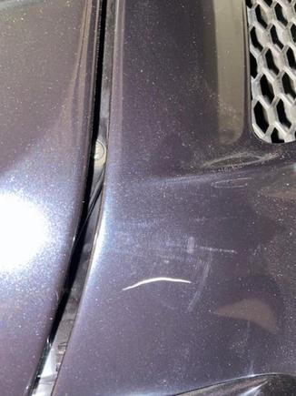 Location: driver side rear deck lid