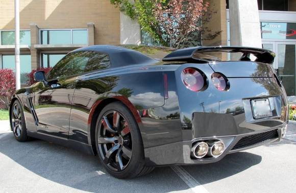 2010 Nissan GTR - Debadged , door handles painted black, all metal side vents and other aluminum painted in candy apple black to give a cleaner black out look