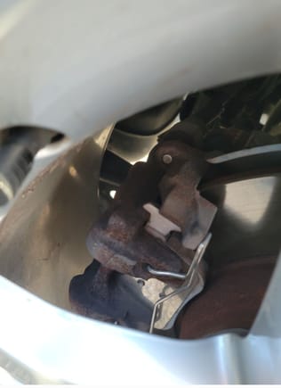 Quick question, is this how a rear brake caliper should look on a 2017 audi a3 quttro, or is there a cover of some sort over the pad thats missing?