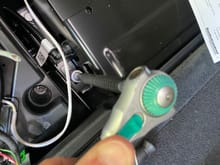 Loosen one of the bolts to the amplifier to attach a ground wire 
