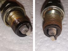 Spark plugs 1 and 2 respectively. Notice the condition of #1. It has significant wear, and needs to be replaced. Besides the oil of course. The thick brown line around the top of the threads is indicative of burning oil. Or so I saw on a Youtube vid. Correct me if I'm wrong. :D