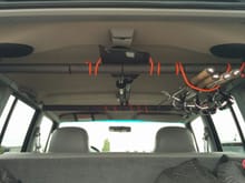 Interior fishing pole and kayak paddle rack.  Made from adjustable closet bars for about $10/each.  They come with end caps that are easily modded to act as brackets to hang into the trim.  This was taken when I first put it in.  I have since added clips to the rear bar so that the poles and paddle just clip in below the rear pole and go over the front pole.