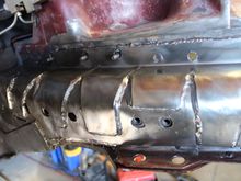 Driver side, first i plated the flat vertical surface with 11 gauge flat stock to give a solid surface to weld to. Then 1/8 plate was bent in a brake with about a 1 inch return. shape fit and cut to a custom fit so that it wrapped down to lay over the 11 gauge material.  plasma cut holes to expose original mounting holes in case I want to use them later for ??