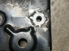 I also tack welded a flat washer into the recessed around of the bolt hole. The washer is slightly higher that the surface of the bracket, for ease of bolting the flat bracket on.