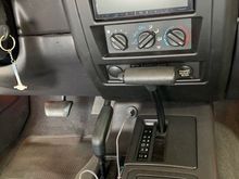 Radio with new USB outlet right in front of parking brake (on center console)