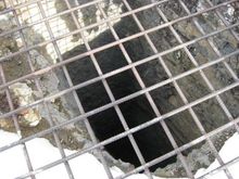 Believe it or not, there's a Jeep at the bottom of this old mine about 100 feet strait down!