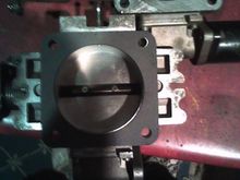bored 63mm tb vs stock size, stock on top right, bored on bottom left