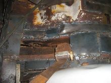 Driver Side, under rear seat