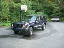 Purple 1999 with new front end. All Craigslist pieces that I installed after straightening the front end out with a few pulls with a chain and the Tractor. Had to chain Jeep to a tree because the tractor was pulling it in park! Fun.