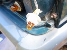 I painted the bulb holder white.
I changed the clear bulb to an amber one.
Clear side markers require amber bulbs.