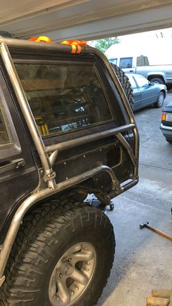 Here’s how I did the sides. The braces provide triangulation without interfering with the window or gas cap.