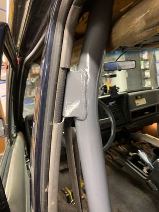 This bracket bolts to the upper seatbelt mount. Had to trim the plastic trim a bit.