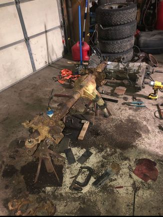 Axle disassembly. note the transmission/transfer case in the background.